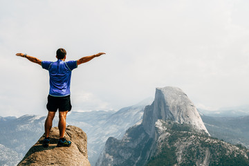boy observing panoramic view of half dome