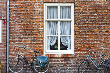 Fototapeta na wymiar Window and Bicycles in Holland