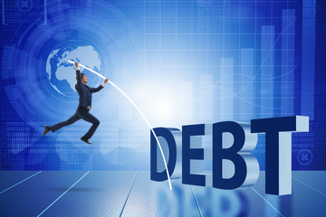 Businessman avoiding debt burden in business concept