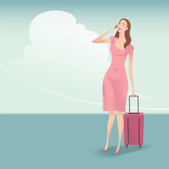 The pretty woman traveller with suitcase walking and talking on the phone, She wearing a pink dress on blue sky background.