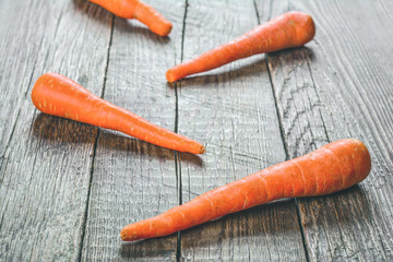 Carrot on wooden surface