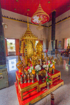 a golden Buddha image interred up to the cheat in Wat Phra Thong temple Phuket.