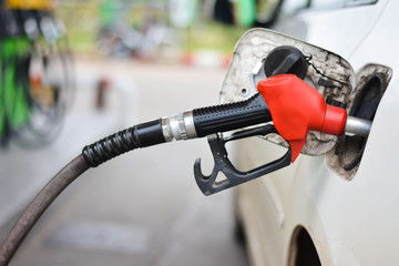 Filling Car With gasoline At Petrol Station