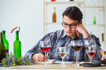 Professional sommelier tasting red wine 