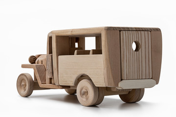 Toy old bus made of natural wood, rear view.