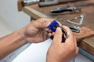 jewelry craftman use vernire calliper measur ring's wax mold