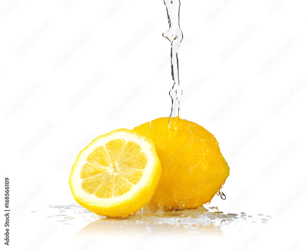 Poster fresh lemons with jet of water on white background