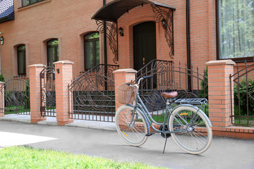 Fototapeta na wymiar Bicycle with wicker basket on street
