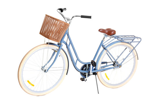 Fototapeta Bicycle with wicker basket on white background