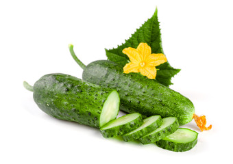Sliced cucumber with leaf and flower isolated on a white background