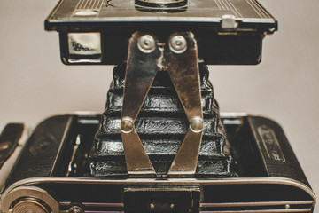 Old vintage retro camera still life on fabric background close up