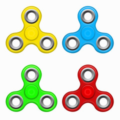 Yellow, red. blue, green colorful spinners on a white background. Hand fidget spinner toys - stress and anxiety relief. Modern children's toys - spinner.