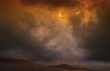Crescent moon with beautiful sunset backgroundLight in dark sky . Sunset Desert Beauty . Dramatic...
