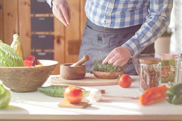 male cooking healthy salad
