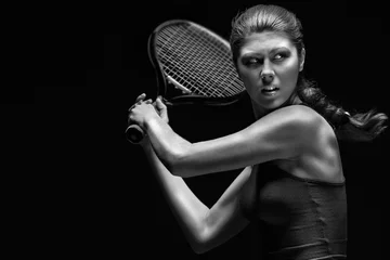 Fototapeten Ready to hit / A portrait of a tennis player with a racket. © Fisher Photostudio