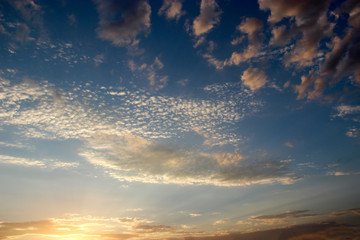 Naklejka na ściany i meble background of the sunset sky and some clouds
