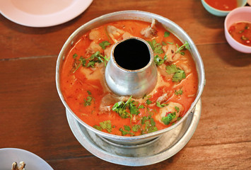 Hot and sour soup with fish. Thai food in hot pot.