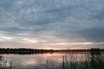 Beautiful peaceful landscape with sunset on the lake