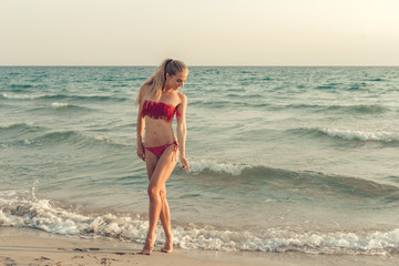 Beautiful girl at the sea posing