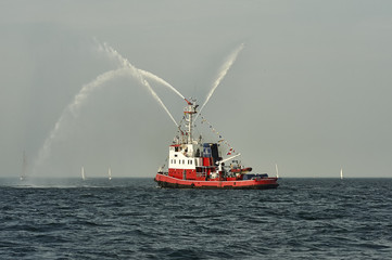 Fireboat, pumps a stream of water - shows for watchers
