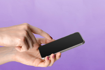 Young woman holding a mobile phone