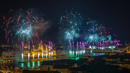 Budapest, Hungary - 20th of August fireworks on St. Stephens or foundation day of Hungary. This view includes the Hungarian Parliament, Liberty Statue, Gellert Hill, Citadell and Chain Bridge
