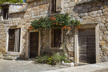 Fototapeta na wymiar Old beautiful traditional dalmatian house in Komiza, Vis island - Croatia