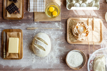 fresh dough on kitchen  rustic wooden table. top view