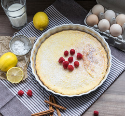 Homemade cheesecake with raspberries and lemon. Delicate dessert for coffee