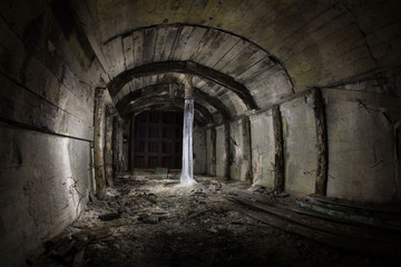 Fototapeta na wymiar Ice column in an abandoned bunker