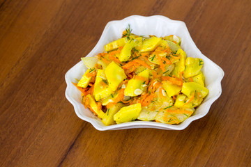Salad of marinated zucchini with carrot and spices