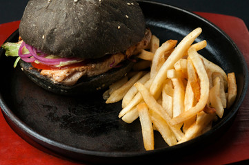 hamburger with fries on a pan
