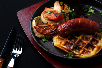 juicy sausage grill on a beautiful pan with vegetables
