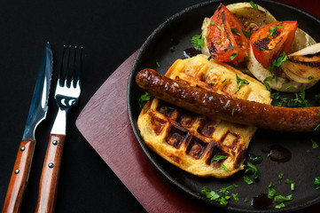 juicy sausage grill on a beautiful pan with vegetables
