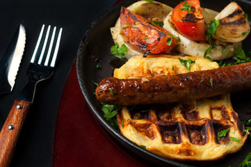 juicy sausage grill on a beautiful pan with vegetables
