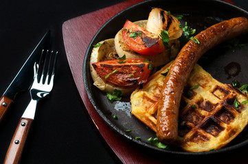 juicy sausage grill on a beautiful pan with vegetables

