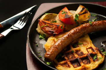 juicy sausage grill on a beautiful pan with vegetables
