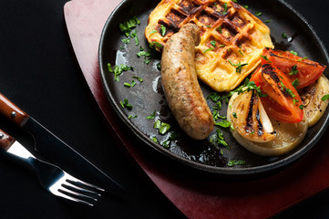 juicy sausage grill on a beautiful pan with vegetables
