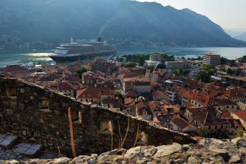 Aerial View of Kotor Old Town with the Historic Orange Tiled Roof Buildings and Bay of Kotor, Montenegro