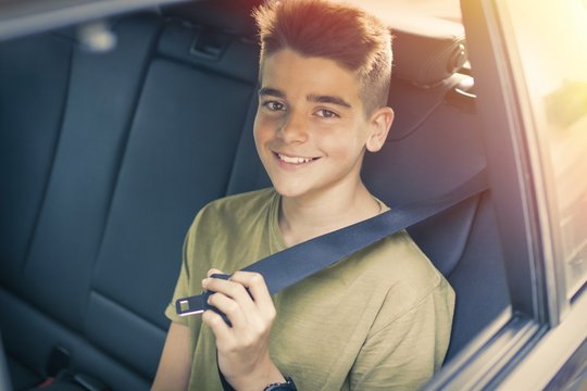 child with seatbelt in the car