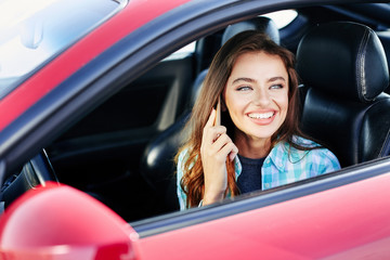 Woman talking on phone while driving