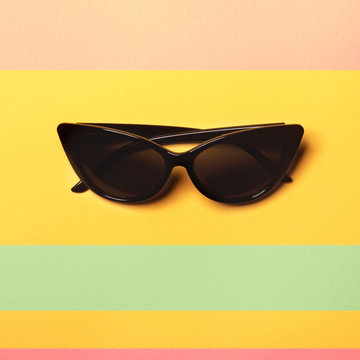 Flat Lay Fashion: Sunglasses On Pastel Backgrounds. Top View