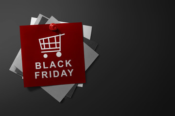 Black Friday text on red paper