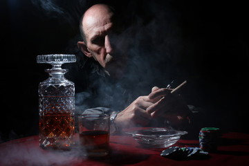 man smoke pipe and play poker