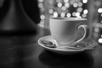 cup of coffee on wooden table in tha cafe