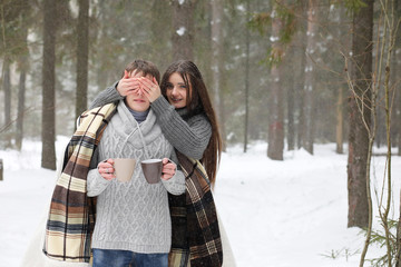 pair of lovers on a date winter afternoon in a snow blizzard