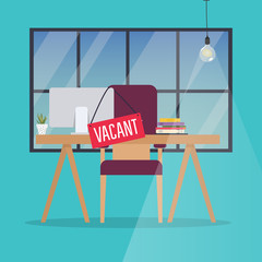 Job vacancy. Office desk with chair, computer and Vacant sign hanged on it. Business hiring and recruiting concept.