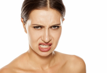 Portrait of angry young women on a white background