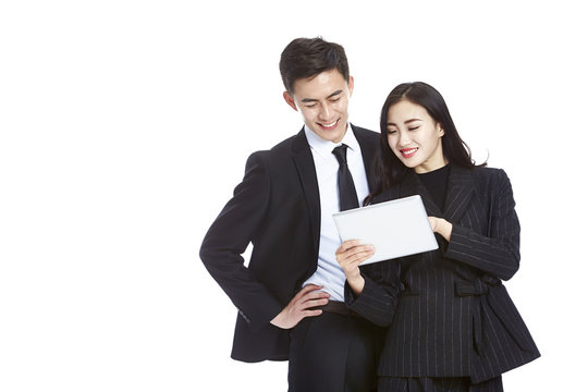 Asian Business Man And Woman Using Digital Tablet, Isolated On White Background. 