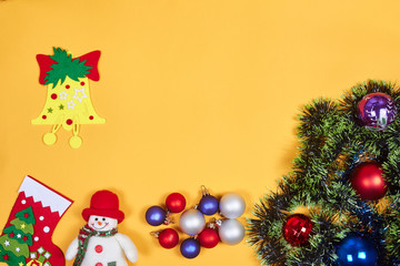 Fototapeta na wymiar Flat lay of Christmas decoration on yeallow background